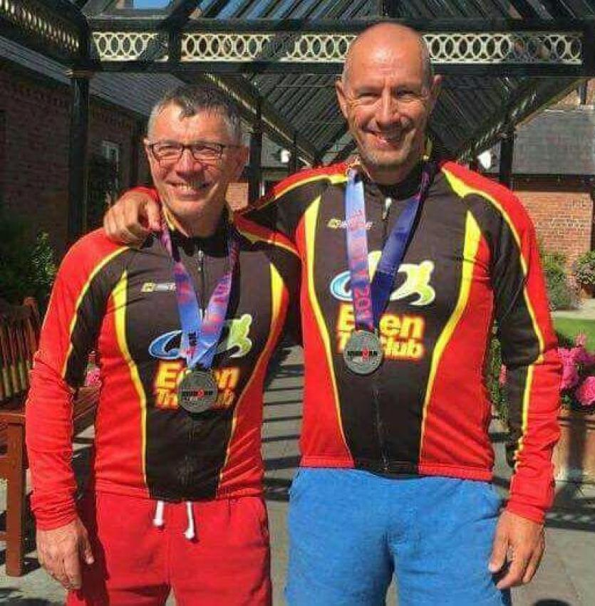 Damien Mc Conagh and Ed Byrne proudly wearing their Ironman UK medals.