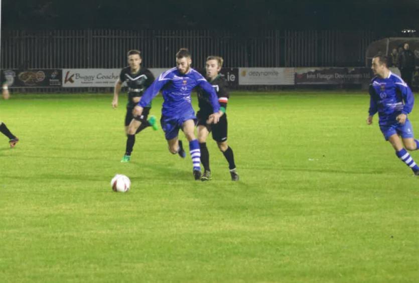 Macdarragh O'Neill on the attack with Brian Francis in support.