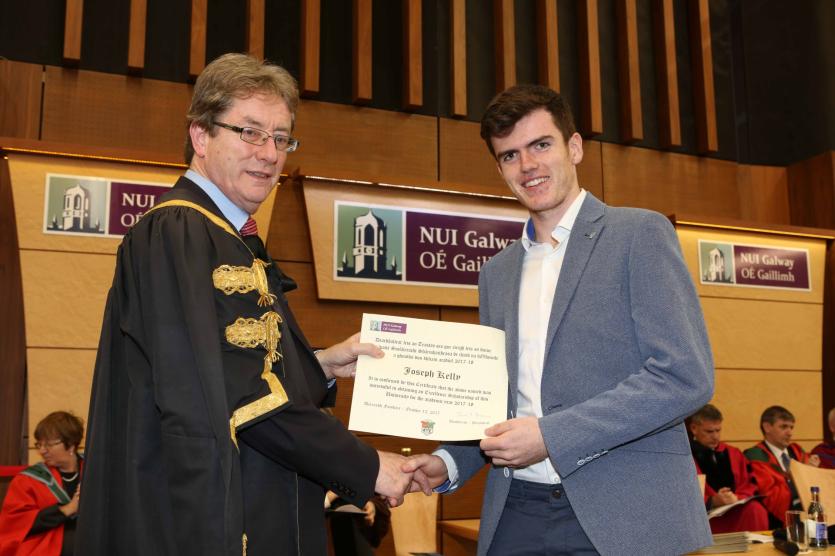 Pictured receiving an Excellence Scholarship scroll and a cheque for &euro;1,500 from NUI Galway President, Dr Jim Browne, is Joseph Kelly from Birr, Co. O