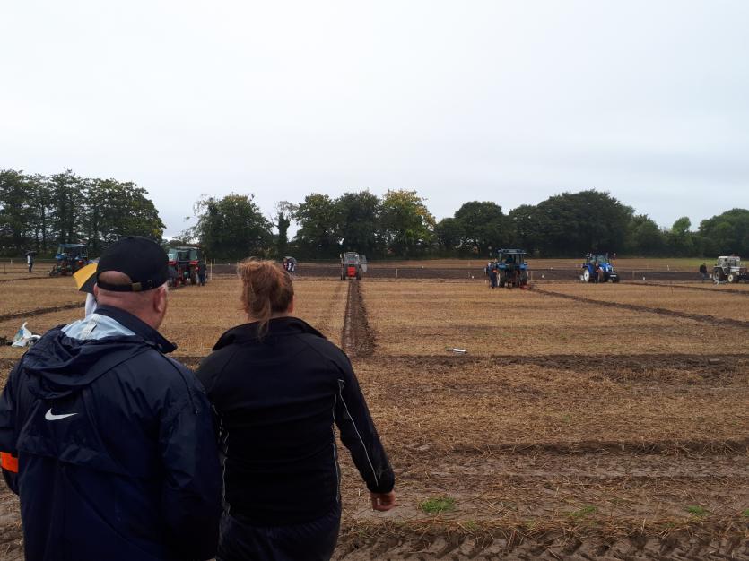 Offaly woman Laura Grant inspects her furrow during the Farmerette Class at the 2017 National Ploughing Championships in Tullamore
