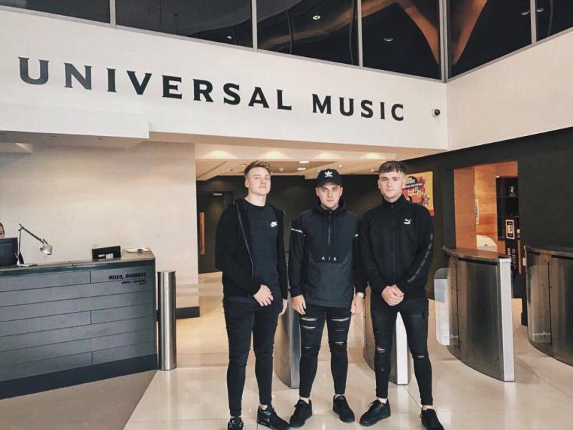 Tullamore band Chasing Abbey put pen to paper on a record deal with Universal