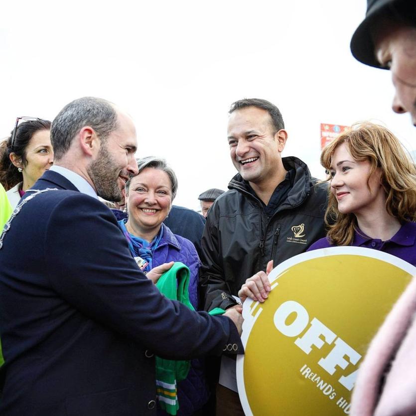 Taoiseach Leo Varadkar sees the funny side as Cathaoirleach of Offaly County Council, Liam Quinn, presents him with a pair of novelty socks