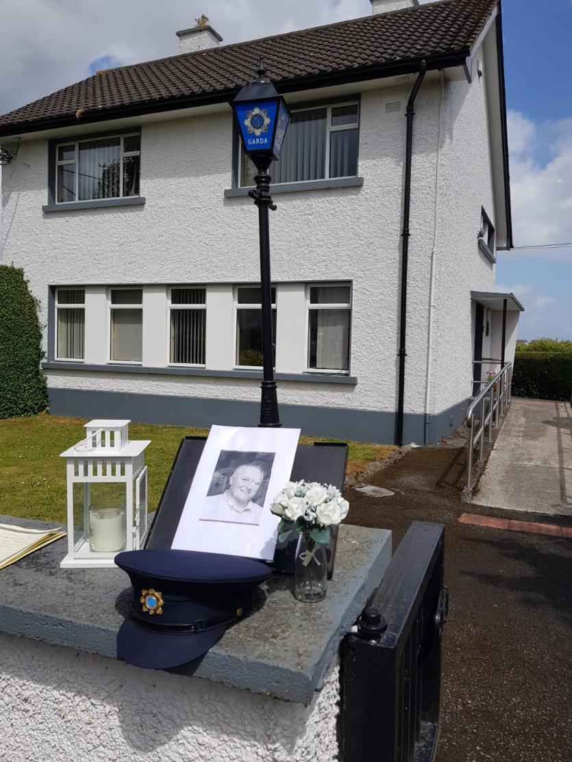 Paying tribute to Detective Colm Horkan outside Cloghan Garda Station