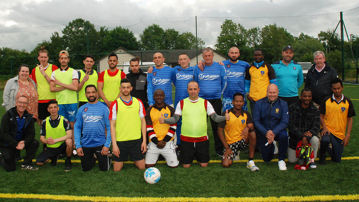 Pictured at the soccer blitz are officers and members of Killavilla  FC,Councillor Shane Lee, members of Roscrea Gardaí and some of Roscrea's asylum community - Photo: PJ Wright
